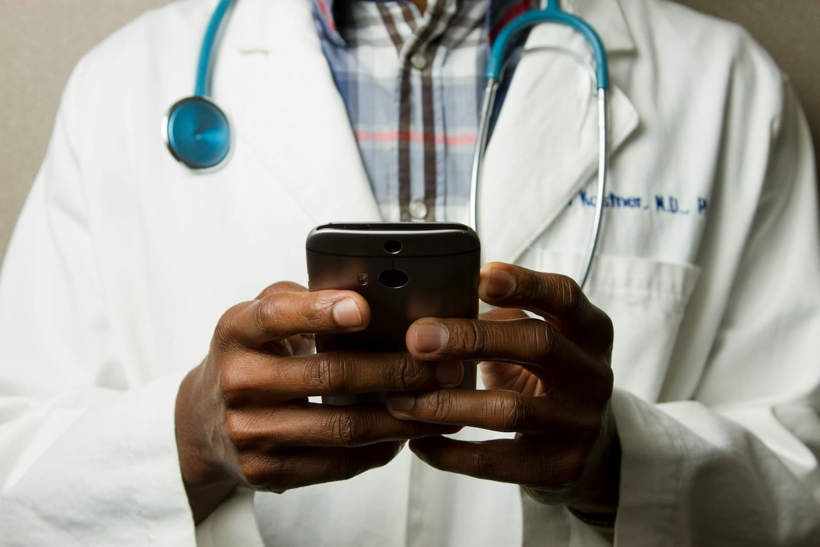 Clinician using a mobile device at a hospital — ChrelTech builds healthcare software for care teams